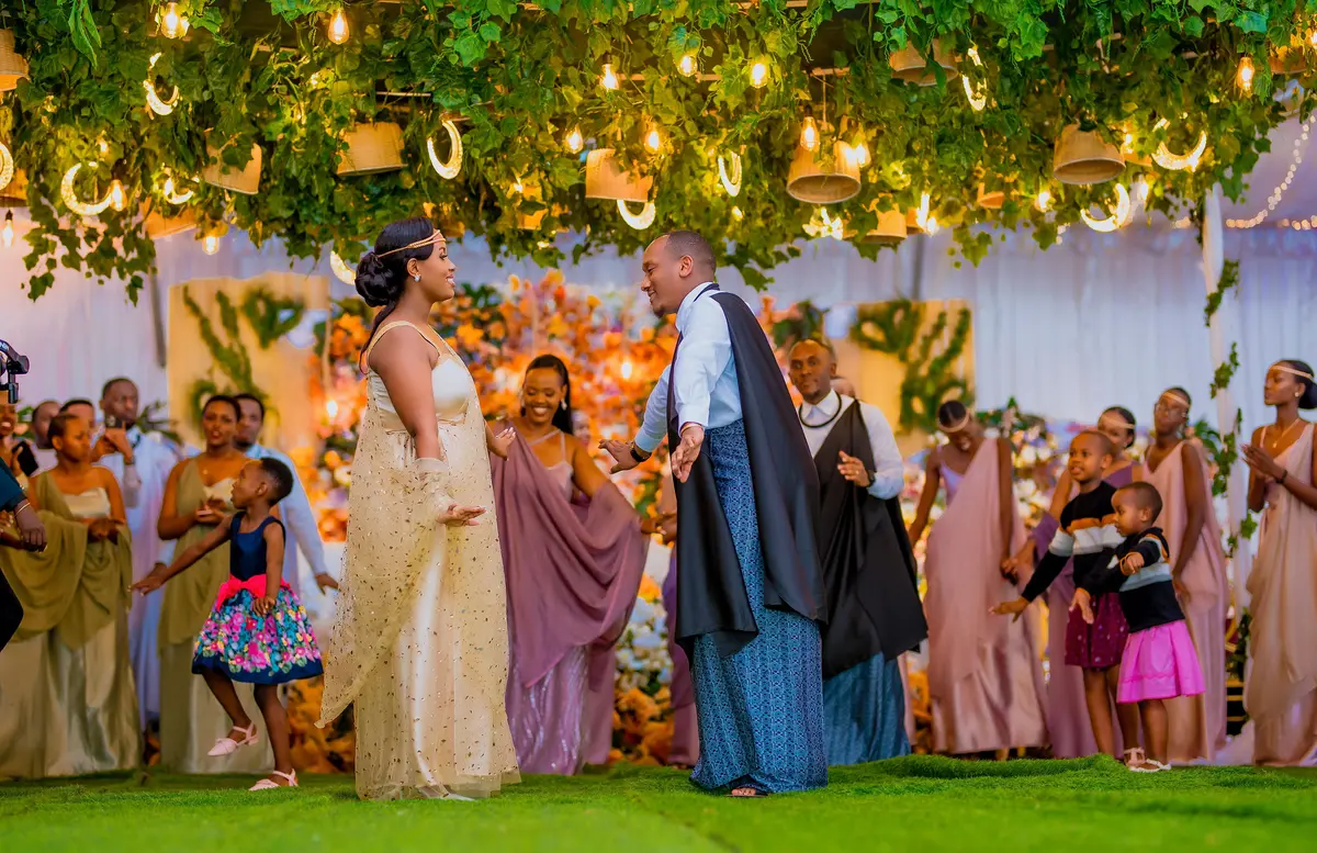 Traditional Rwandan wedding ceremony with couple dancing - cultural event photography Kigali